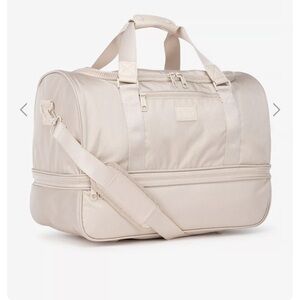 Calpak Stevyn Duffel Bag with Shoe Compartment- Color Dune